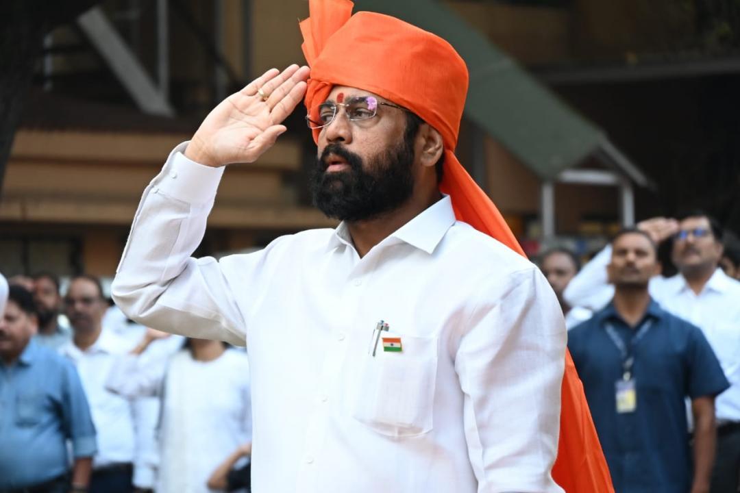 Maharashtra Chief Minister Eknath Shinde salutes after unfurling the national flag during the 74th Republic Day celebrations, at his official residence in Mumbai